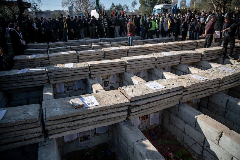 Graves wait to be filled during a mass funeral for 95 people in Aitaroun, south Lebanon. Photograph: Sally Hayden