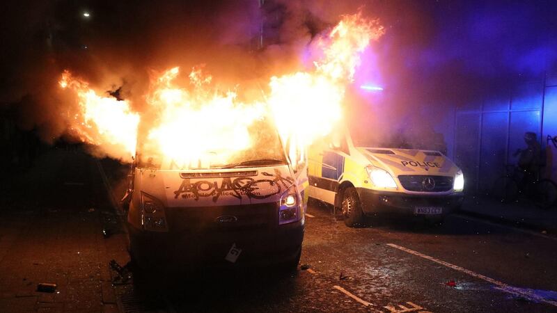 A vandalised police van on fire outside Bridewell Police Station in Bristol on Sunday night. Photograph: Andrew Matthews/PA Wire