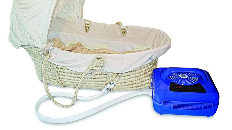 The specially designed cuddle cot: Its thin mattress is filled with cold water and then connected to a cooling unit which is plugged in, keeping the mattress constantly cold.