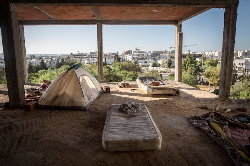 Tents and mattresses in an unfinished building in Tunis which is home to migrants from Sudan and Somalia, many of whom are hoping to cross the Mediterranean to Europe. Photograph: Sally Hayden