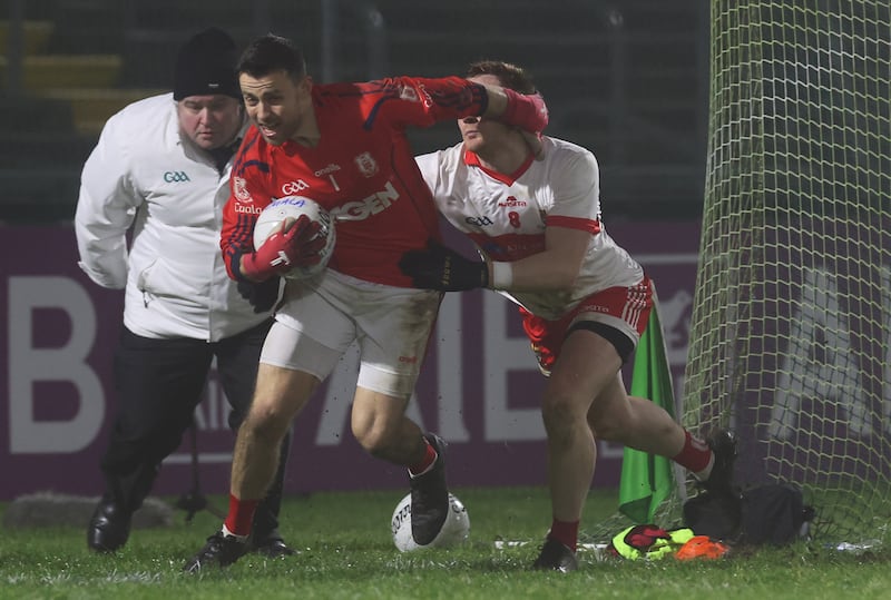 Coolera’s Kevin Banks and Ryan Scollard of Cuala in action in Breffni Park. Photograph: Lorraine O’Sullivan/Inpho