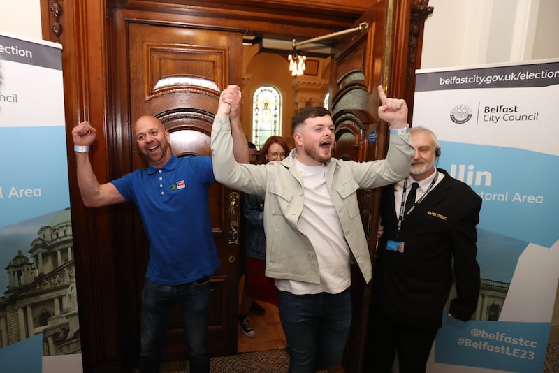 Joe Duffy (left) and Caoimhin McCann from Sinn Féin celebrate at Belfast City Hall on Saturday. Photograph: Liam McBurney/PA Wire