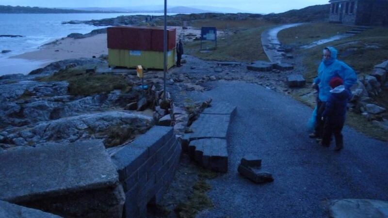 Inspecting the damage to a sea wall at Carraroe, Co Galway. Photograph: Mark Lydon