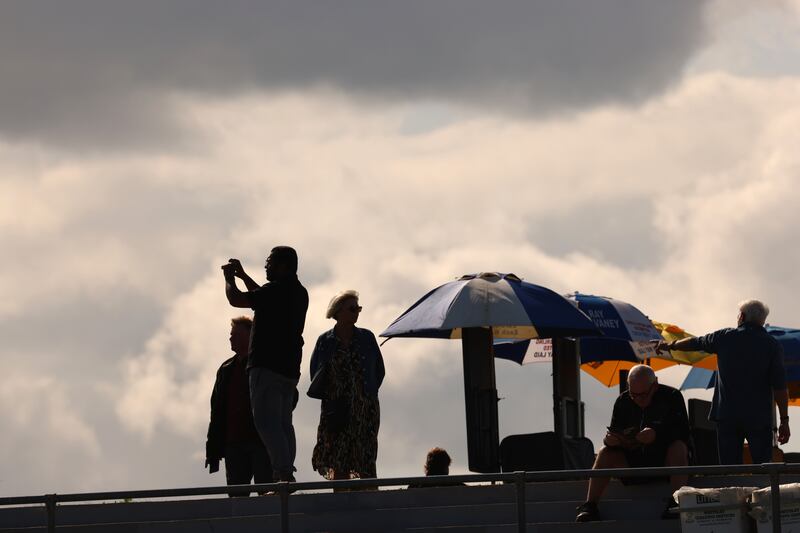 A man snaps a photo on his phone during the Laytown Races. Photograph: Dara Mac Dónaill/The Irish Times
