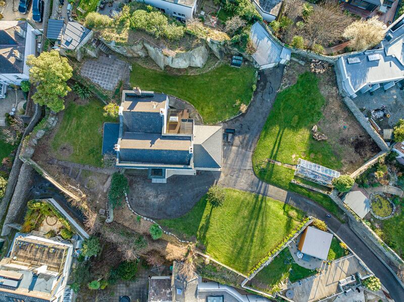 Aerial view of the 0.5 acre site, with large granite rock to the rear.