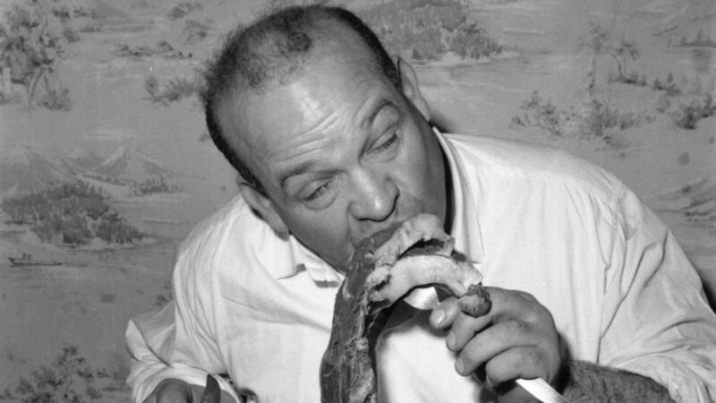 London publican Butty Sugrue, a former circus strongman enjoying a meal in 1965. He and American Harold Conrad helped   promote the fight between Muhammad Ali and Al Blue Lewis in Dublin in 1972. Photograph:  Art Kahn/BIPs/Getty Images