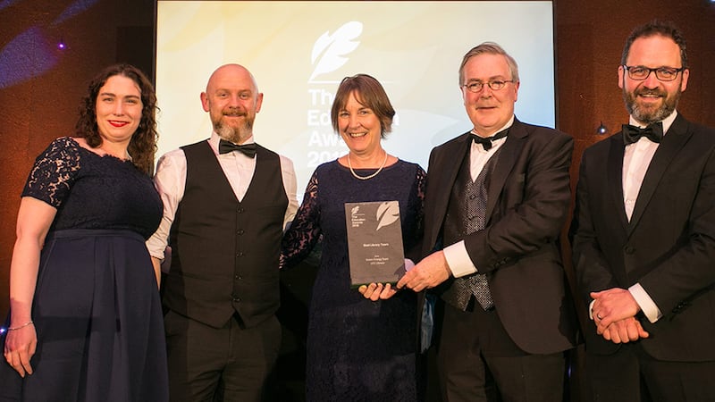 Prof. Louis Brennan, Trinity Business School presents Best Library Team Award to UCC Library Team.