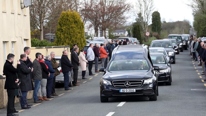 Mourners line the street as the Hearse carrying the coffin of Aidan Moffitt arrives the Christ the King Church, Lisacul, Sligo. Photograph: RollingNews.ie