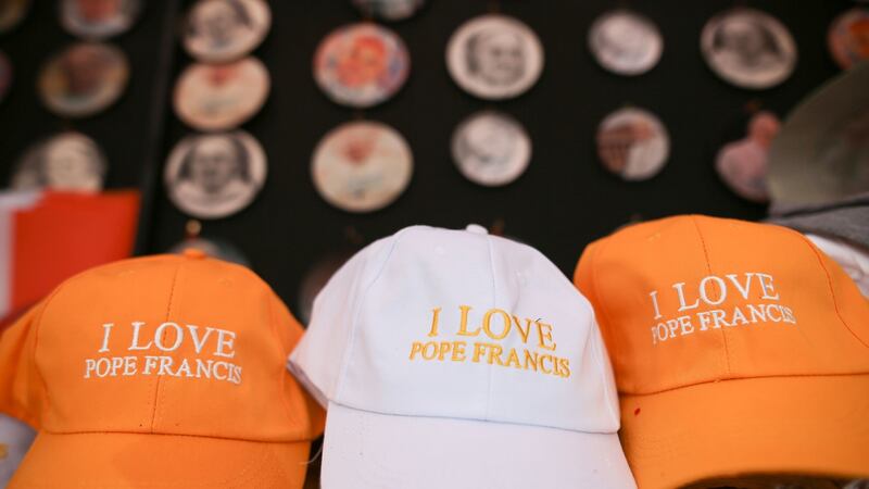 ‘I Love Pope Francis’ hats on sale in Dublin, ahead of this weekend’s visit to Ireland by Pope Francis. Photograph: Aaron Chown/PA Wire