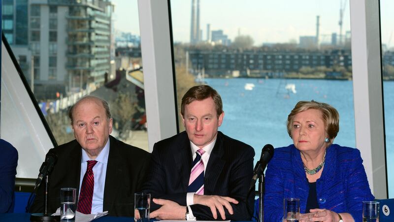 Taoiseach Enda Kenny (centre) with Ministers Michael Noonan and Frances Fitzgerald at the final Fine Gael press conference before the general election at Dublin’s Bord Gáis Energy Theatre. Mr Kenny has said he has no regrets about not calling an election in November because an early poll would have ‘ruptured’ ties with the Labour Party. Photograph: Dara Mac Dónaill/The Irish Times.