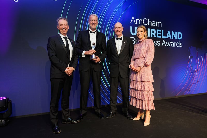 Shay Walsh, managing director BT Ireland presents the global impact award to the Icon team at the American Chamber US-Ireland Business Awards. Photograph: Chris Bellew/Fennell Photography