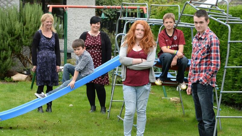 Clare Perry, left, and Layla Moroney with their families, Hannah and Eliot Perry (in red tops) with Kai and Christian Moroney (in check shirts).  Photograph: Cyril Byrne