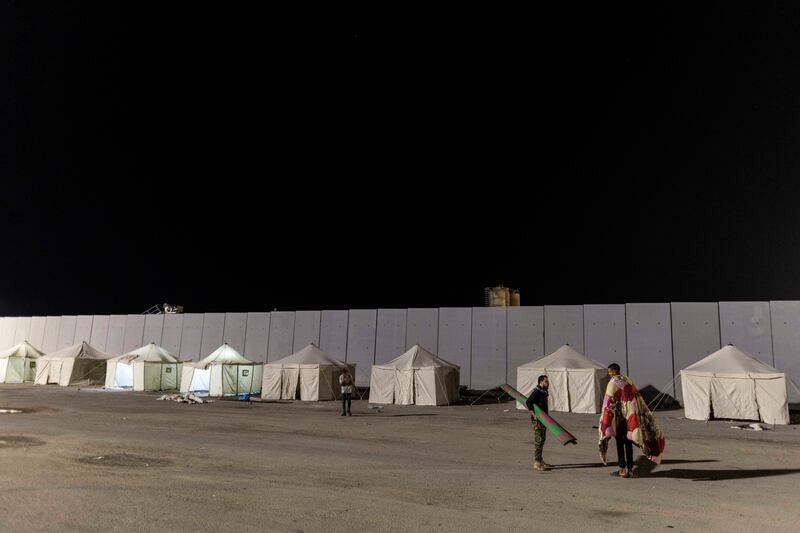 Volunteers and NGO staff camp in front of the Rafah border as they wait to deliver aid supplies to Gaza on October 19th, 2023 in north Sinai, Egypt. Photograph: Mahmoud Khaled/Getty Images