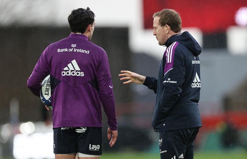 Joey Carbery talkings things over with Munster's attack coach Mike Prendergast. Photograph: Billy Stickland/Inpho