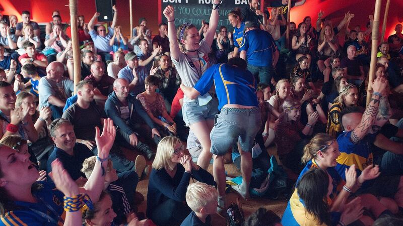 Kilkenny fans celebrate at Electric Picnic as Tipperary beat Kilkenny in the All-Ireland hurling final. Photograph: Dave Meehan/The Irish Times