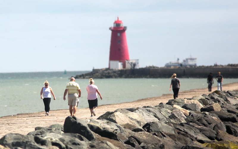 Walking the great South Wall towards Poolbeg Lighthouse, Dublin.
Photograph: Gareth Chaney/Collins Photos