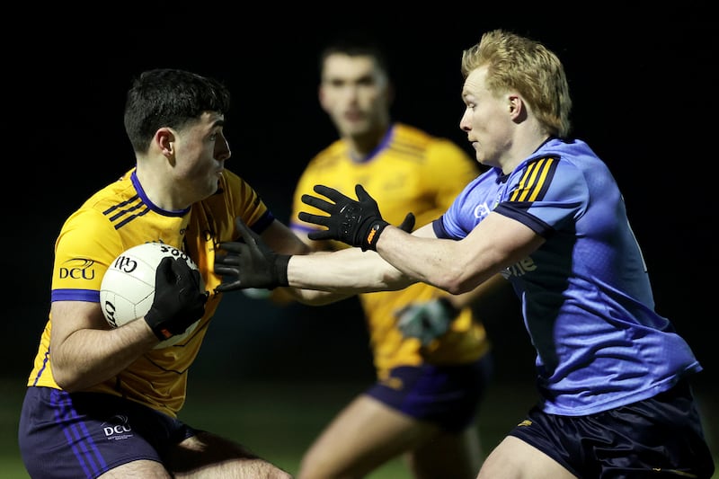 DCU Dóchas Éireann's Ryan Donoghue and Cormac Egan of UCD. Photograph: Laszlo Geczo/Inpho