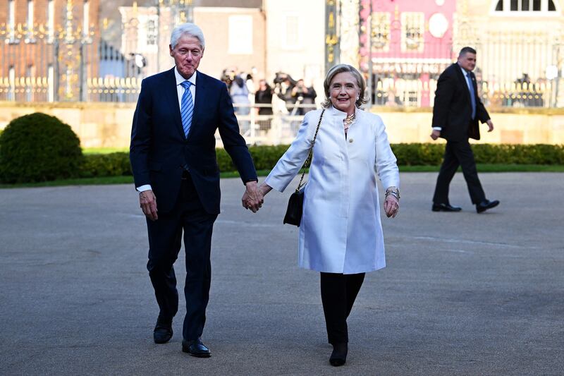 Hillary and Bill Clinton arrive for the closing gala on the final day of the conference. Photograph: Charles McQuillan/AFP via Getty Images