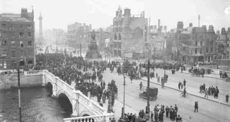 Crowds gather on O'Connell Bridge in the aftermath of the 1916 Rising. Photograph: Courtesy of The National Library of Ireland