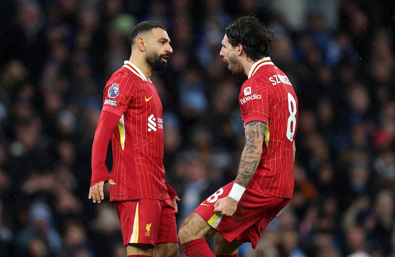 Liverpool's Dominik Szoboszlai celebrates scoring his team's second goal with Mohamed Salah. Photograph: Alex Pantling/Getty Images