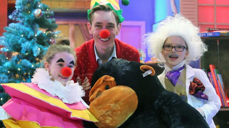 Tubridy’s little helpers:  Julia Dempsey (8) from Carlow (left) and Cara Hayes (9) from Dublin at work with the master of ceremonies. Photograph: Colin Keegan/ Collins