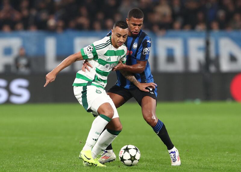 Adam Idah of Celtic competes for the ball with Isak Hien of Atalanta. Photograph: Marco Luzzani/Getty