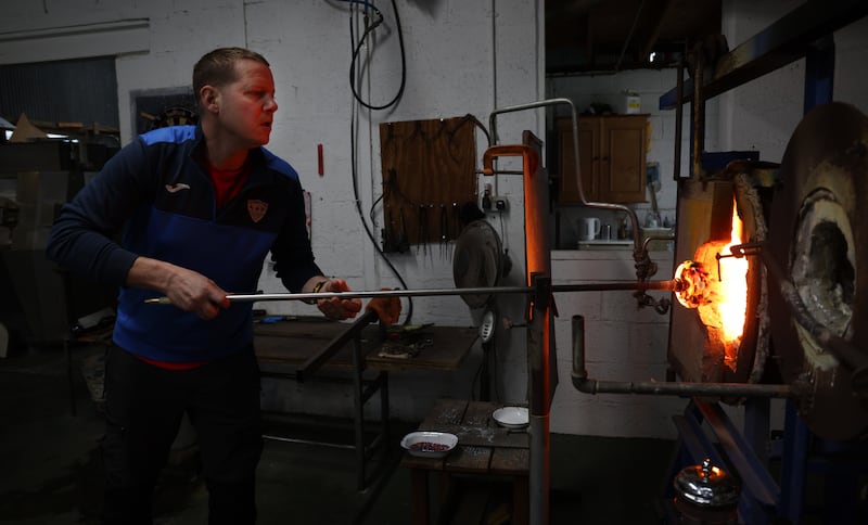 Rory Leadbetter at work in his family’s business, Jerpoint Glass Studio. 