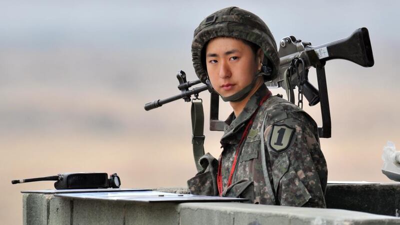 A South Korean soldier stands on a military guard post near the demilitarised zone dividing the two Koreas in the border city of Paju yesterday.  Photograph: Jung Yeon-je/AFP/Getty Images)