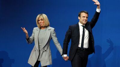 Emmanuel Macron celebrates with his wife Brigitte Trogneux after the first round.