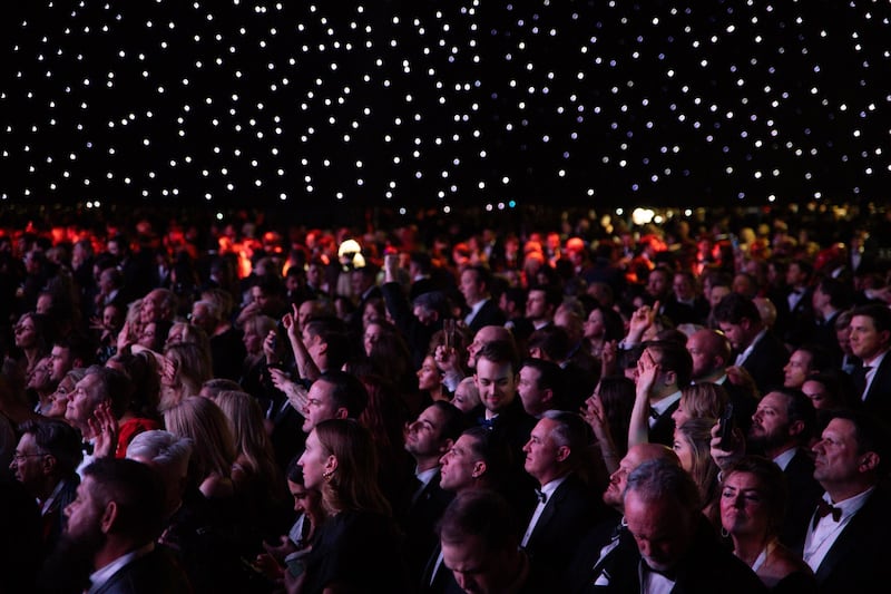 Attendees watch Billy Ray Cyrus perform at the Liberty Ball. Photograph: Maasni Srivastava/EPA