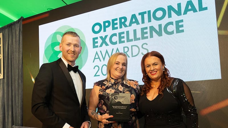 Neil Wall, community director at Business River presents the operational excellence in facilities management to Grainne Carberry and Valerie Golden, Apleona Ireland