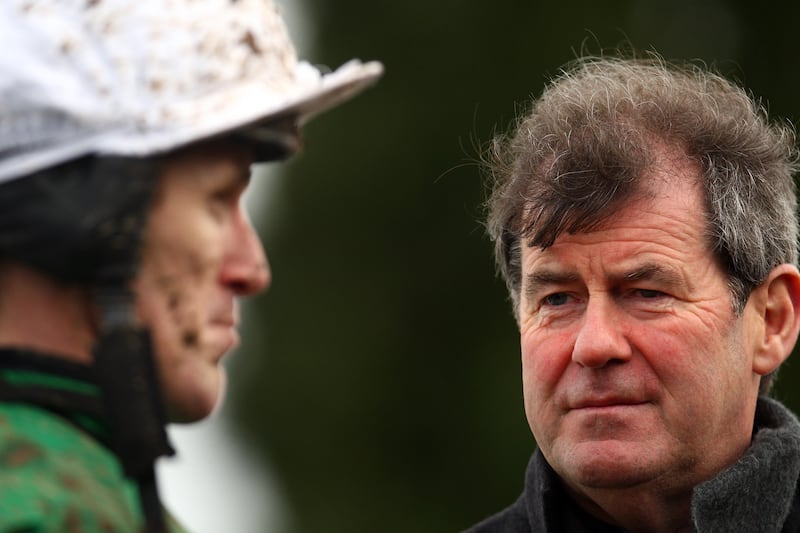 JP McManus with jockey Tony McCoy at Lingfield Park Racecourse, England, in November 2009.  Photograph: Julian Herbert/Getty Images