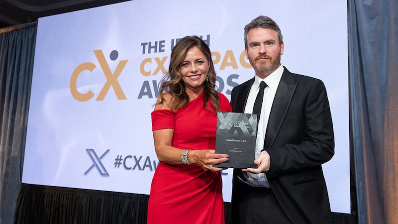 Rachael Corcoran, awards judge, presents the digital impact in CX award to James Reilly, ESB Networks