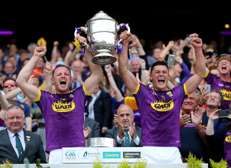 Wexford joint captains Matthew O'Hanlon and Lee Chin lift the Bob O'Keeffe Cup after beating Kilkenny in the 2019 Leinster senior hurling final at Croke Park. Photograph: Ryan Byrne/Inpho