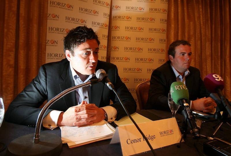 Horizon Sports managing director Conor Ridge and Shane Lowry on the day he announced he was turning professional in May 2009. Photograph: Cathal Noonan/Inpho