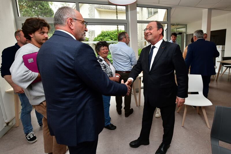 Francis Dubois, a candidate for the centre-right Les Republicains party in Sunday's National Assembly election, greets former French president Francois Hollande, a candidate for the left-wing New Popular Front, prior to a television debate in Limoges on Wednesday. Photograph: Pascal Lachenaud/AFP via Getty Images