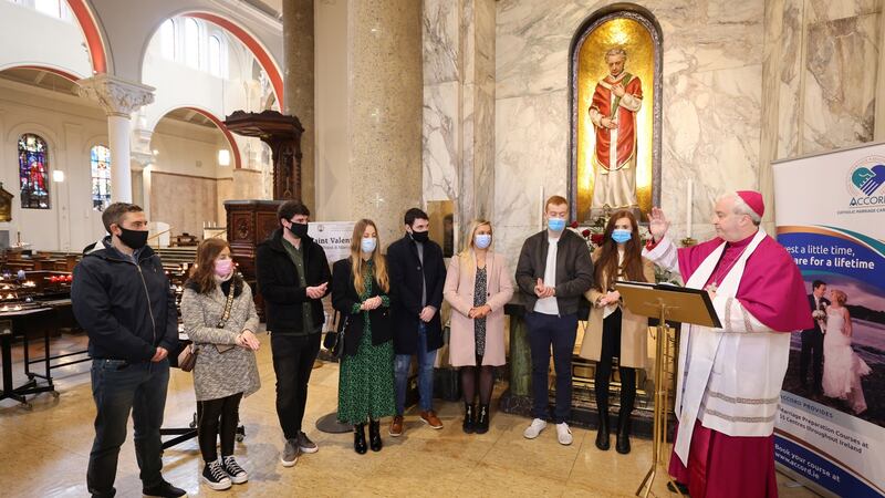 Bishop Michael Router, Auxiliary Bishop of Armagh and vice-president of Accord (far right), blessing four engaged couples at the Shrine of Saint Valentine from left; Colm Humphries, Laura Fitzpatrick, Brendan Mullen, Sinead Lyons, Josh Warde, Heather Andrews and Daniel Queeney and Aisling McEntee, at Our Lady of Mount Carmel, Whitefriar Street Church in Dublin on Saturday. Photograph: Dara Mac Dónaill/The Irish Times