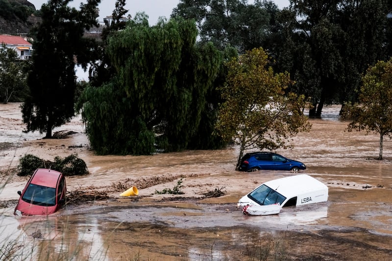 Cars being swept away after floods in the town of Alora, Malaga. Photograph: Gregorio Marrero/AP