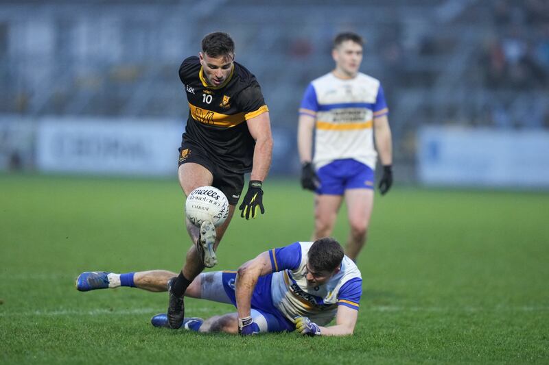 Micheal Burns of Dr Crokes with possession during the game in St Conleth's Park. Photograph: James Lawlor/Inpho