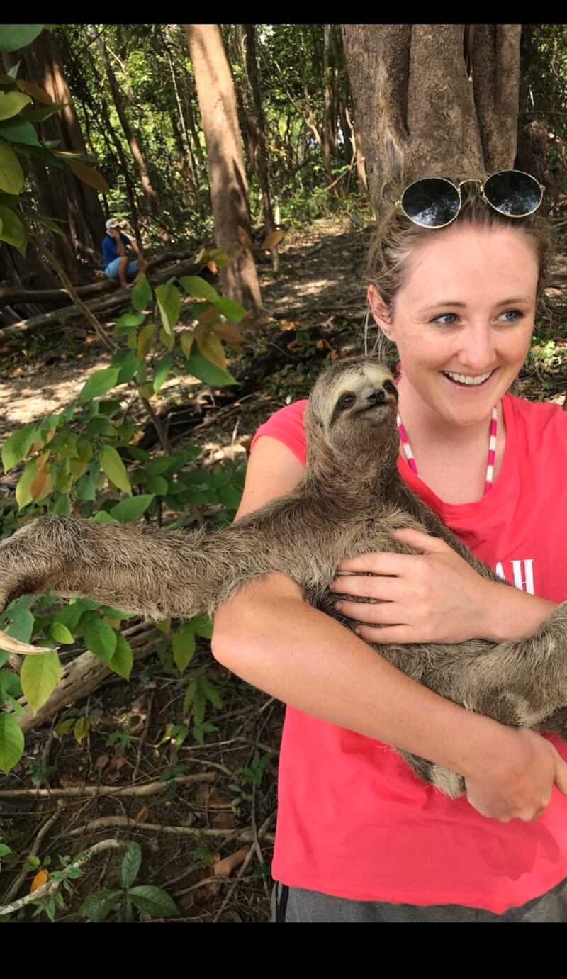 Emma Cahill meets a sloth in the Amazon.