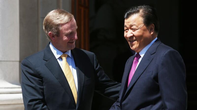 Taoiseach, Enda Kenny, greets Mr Liu Yunshan, at Government Buildings, Dublin.  Photograph: Brian Lawless/PA