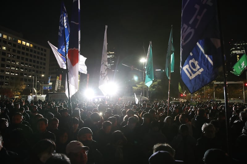 Crowds gather in front of the National Assembly. Photograph: Chung Sung-Jun/Getty Images