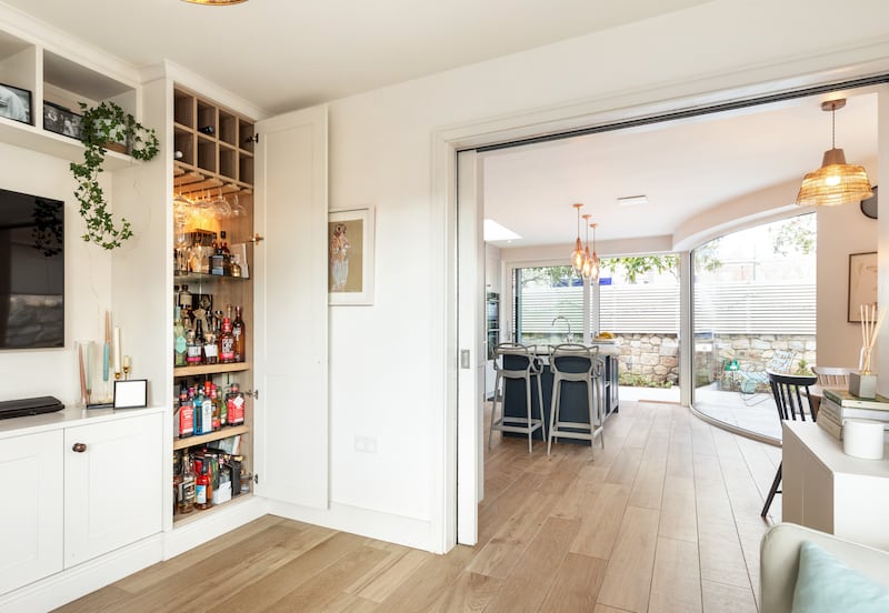 Pocket doors divide the kitchen and living area