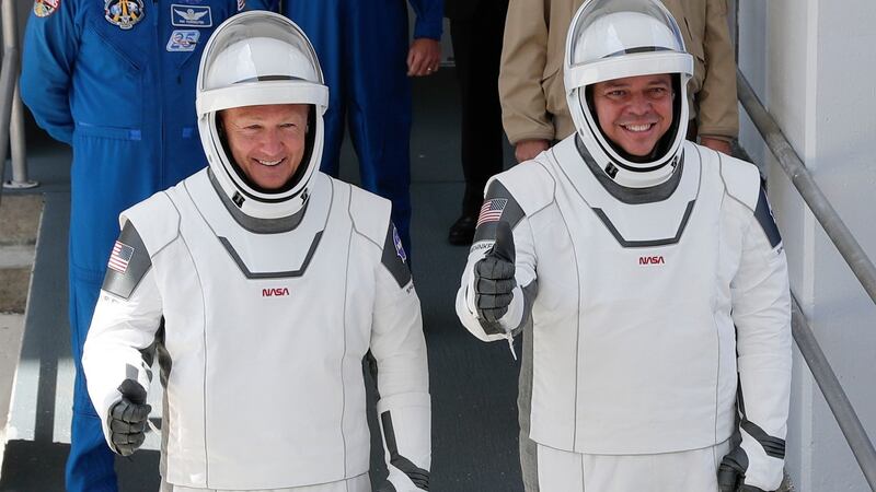 Nasa astronauts Douglas Hurley and Robert Behnken on their way to the launch site at the Kennedy Space Center on Saturday. Photograph: John Raoux/AP Photo