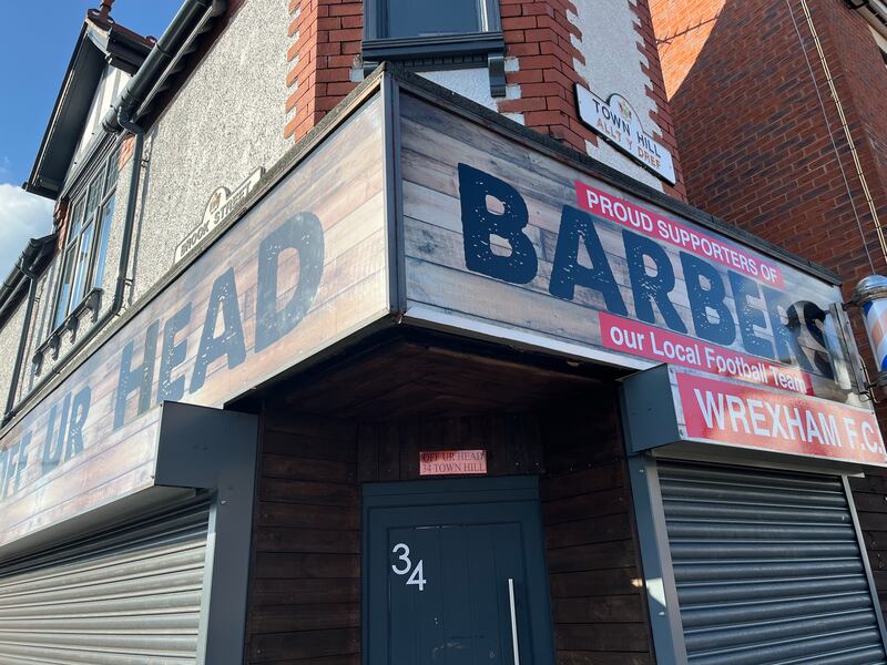 Local businesses show their support, such as Off Ur Head barber shop