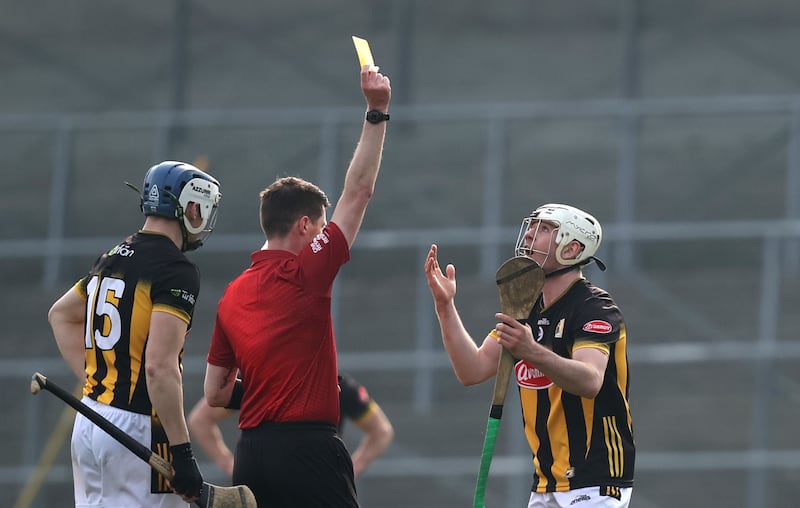 Referee Sean Stack shows Kilkenny's Jordan Molloy a yellow card in the game against Tipperary. Photograph: Bryan Keane/Inpho