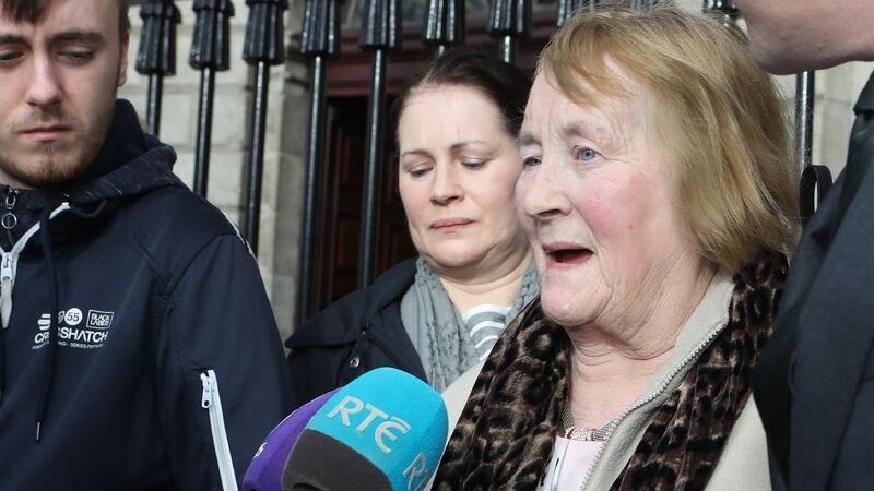 Esther Lonergan  speaks to reporters after her family settled cases against two hospitals following the deaths of her husband and son. Photograph: Collins