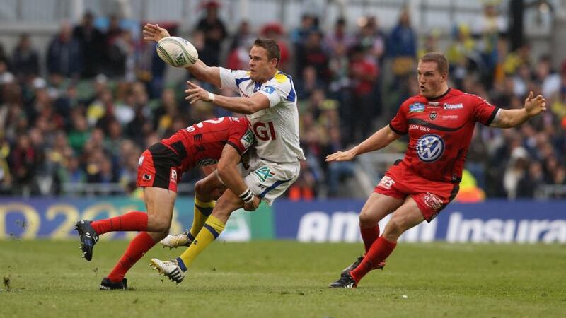 Lee Byrne of Clermont Auvergne is hit hard by  Matt Giteau of Toulon during the Heineken Cup final. Photograph:   David Rogers/Getty Images