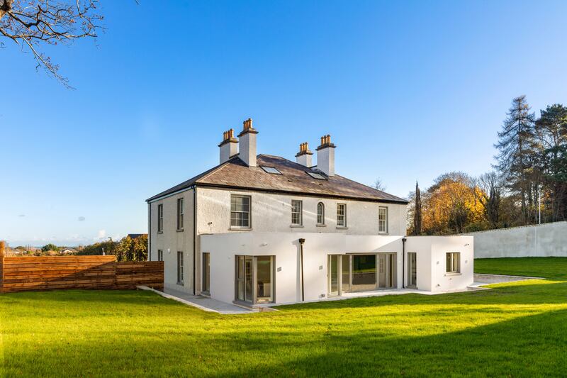 There’s a wide granite patio at the back of the house stepping to a 900sq m lawn.