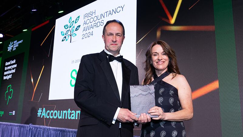 Michael Kavanagh, vice president, CPA Ireland, presents the global achievement in accountancy award to Gail McEvoy.